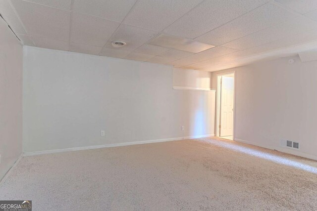 5723 Fieldstone Dr, Lithonia, GA 30038 - spare room featuring baseboards, a paneled ceiling, visible vents, and carpet floors