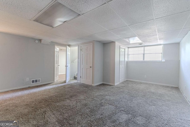 5723 Fieldstone Dr, Lithonia, GA 30038 - basement with a paneled ceiling, carpet, baseboards, and visible vents
