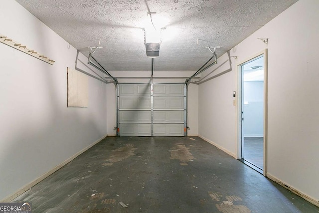 5723 Fieldstone Dr, Lithonia, GA 30038 - garage featuring baseboards and a garage door opener