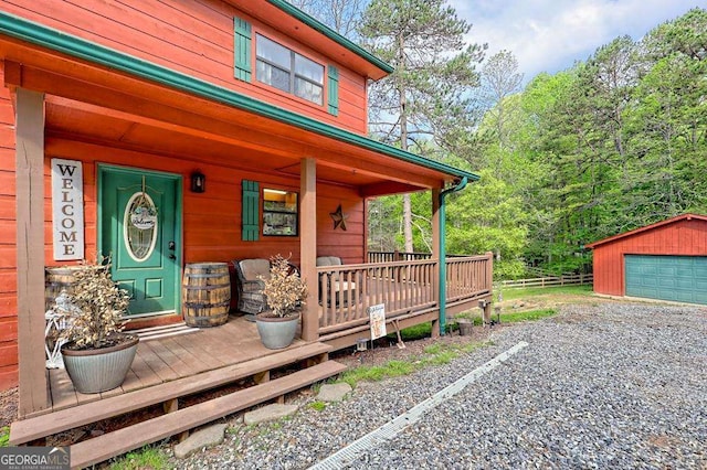 428 Gibbs Rd, Blairsville, GA 30512 - view of exterior entry with a porch and a detached garage