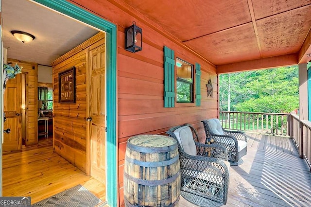 wooden terrace featuring a porch