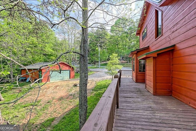 view of yard featuring a wooden deck and an outdoor structure