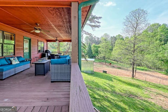 428 Gibbs Rd, Blairsville, GA 30512 - deck featuring an outdoor living space, a ceiling fan, a lawn, and a forest view