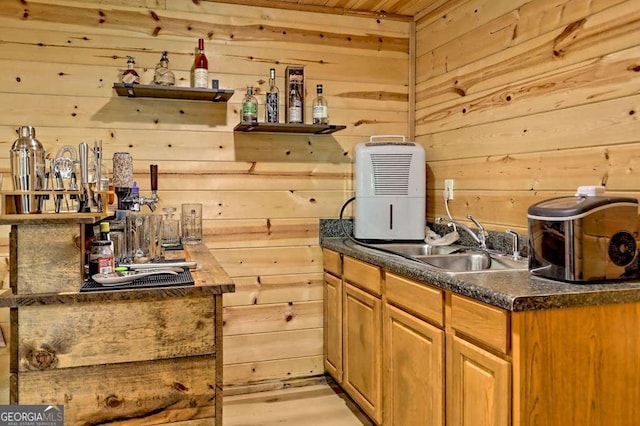 bar featuring a sink, wood ceiling, and wood walls