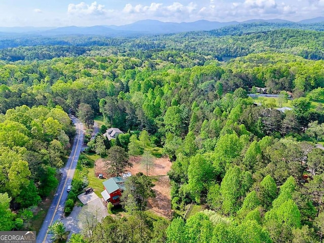 aerial view featuring a mountain view and a forest view