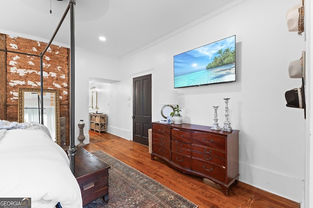 bedroom featuring crown molding, baseboards, recessed lighting, and wood finished floors