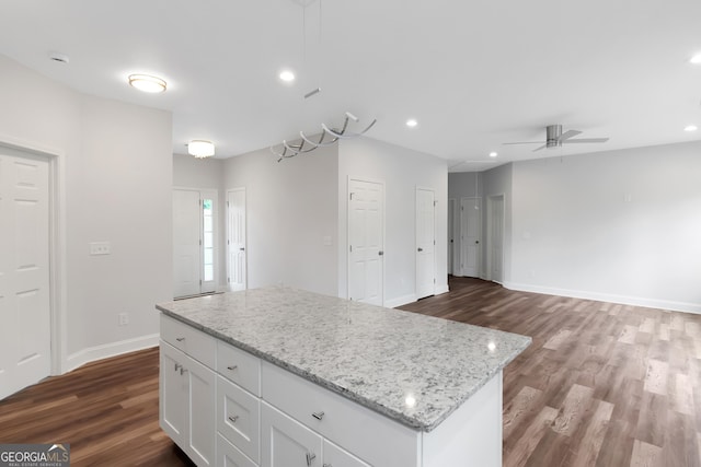 kitchen featuring a ceiling fan, dark wood finished floors, white cabinets, baseboards, and recessed lighting
