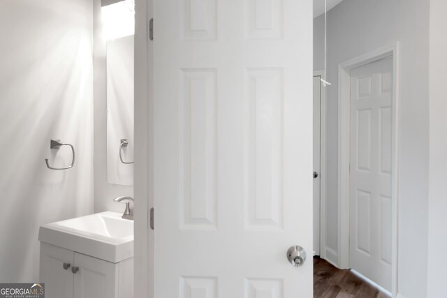 bathroom featuring vanity and wood finished floors