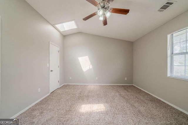 6351 Stablewood Way, Lithonia, GA 30058 - spare room featuring a skylight, ceiling fan, carpet flooring, and lofted ceiling