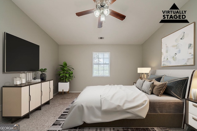 6351 Stablewood Way, Lithonia, GA 30058 - bedroom with carpet floors, vaulted ceiling, and a ceiling fan