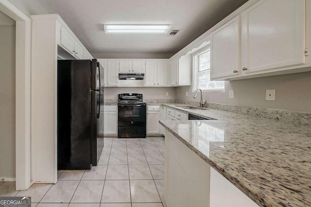 kitchen with white cabinetry, black appliances, light stone counters, and a sink