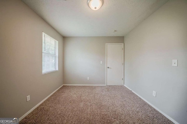 6351 Stablewood Way, Lithonia, GA 30058 - carpeted empty room featuring a textured ceiling and baseboards