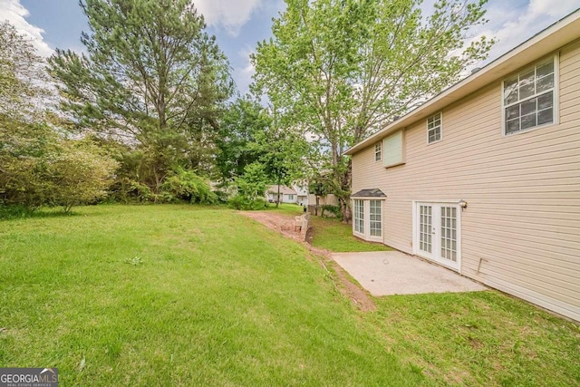 6351 Stablewood Way, Lithonia, GA 30058 - view of green lawn featuring french doors and a patio