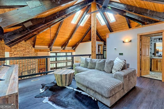 living area featuring a skylight, high vaulted ceiling, ceiling fan, and wood finished floors