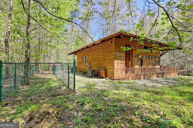 view of outbuilding featuring fence