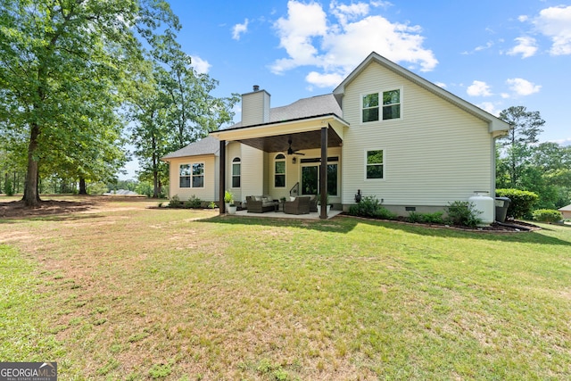 rear view of house featuring an outdoor hangout area, ceiling fan, a chimney, a yard, and crawl space