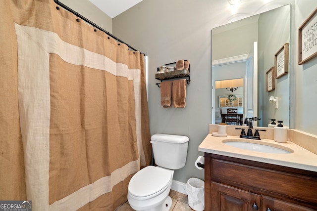 bathroom featuring toilet, vanity, tile patterned flooring, baseboards, and a shower with shower curtain
