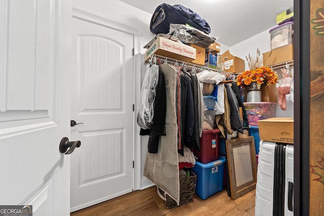 spacious closet with wood finished floors
