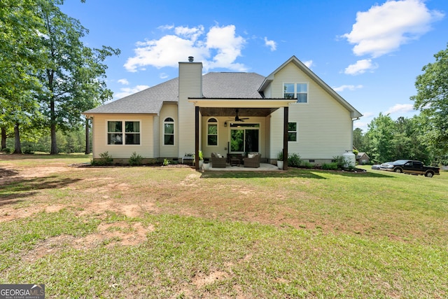 rear view of property with ceiling fan, an outdoor hangout area, crawl space, a lawn, and a patio