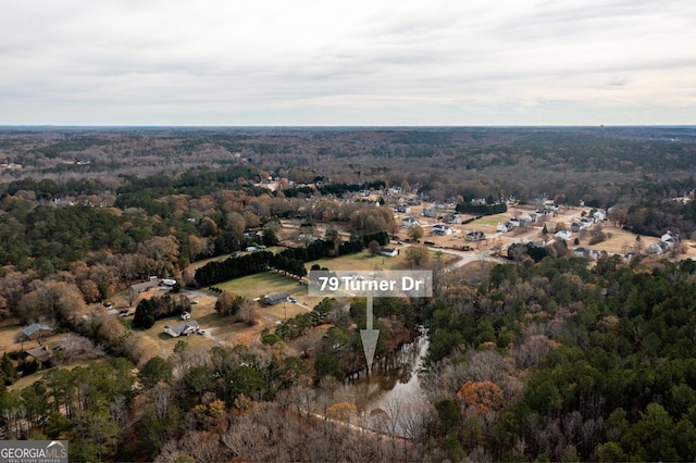 bird's eye view featuring a forest view