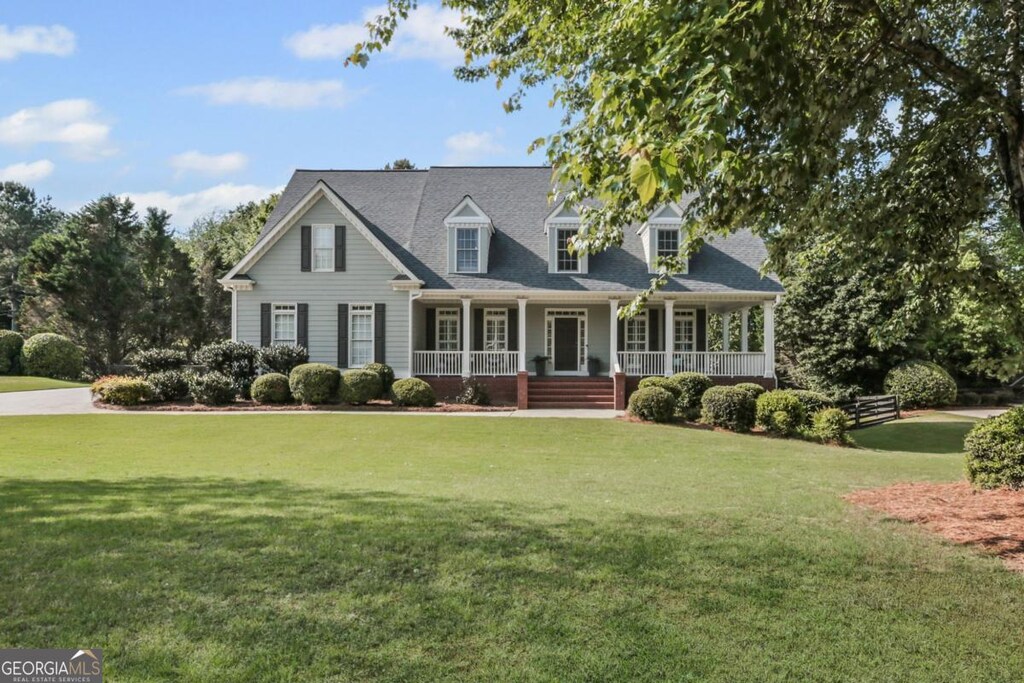 393 Taylor Glen Dr, Milton, GA 30004 - cape cod-style house featuring covered porch and a front yard