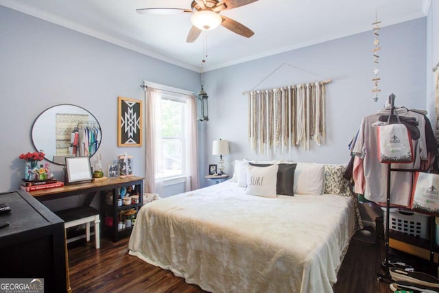 bedroom featuring crown molding, a ceiling fan, and dark wood finished floors