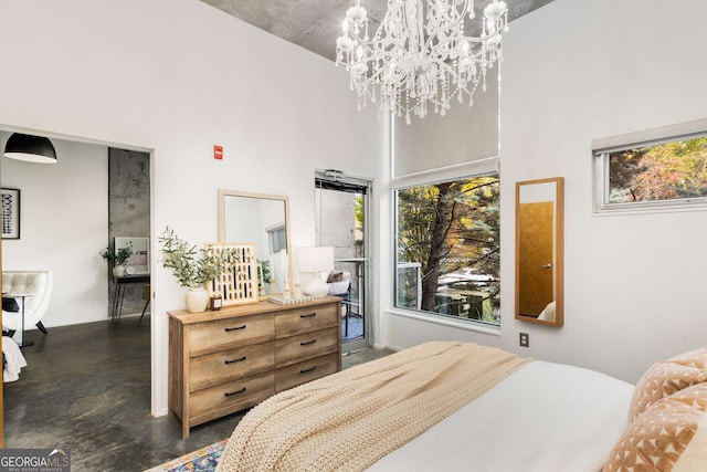130 Arizona Ave NE Unit 104, Atlanta, GA 30307 - bedroom featuring finished concrete floors, a chandelier, and a high ceiling