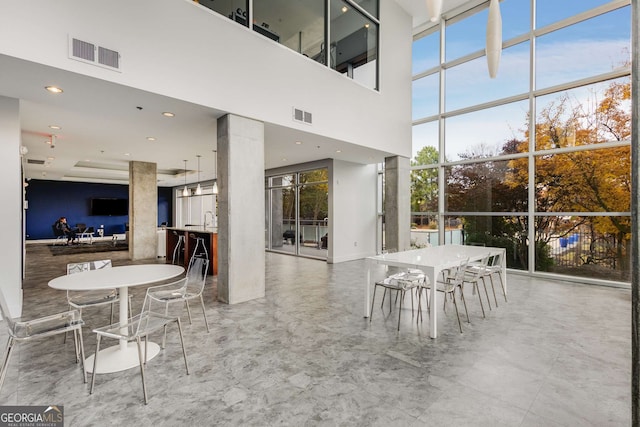 130 Arizona Ave NE Unit 104, Atlanta, GA 30307 - dining area featuring a high ceiling, recessed lighting, and marble finish floors