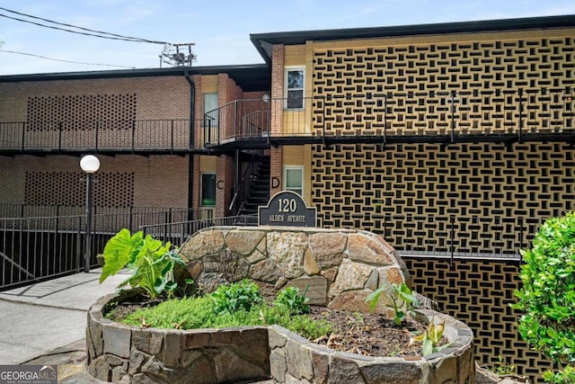 120 Alden Ave NW Unit C3, Atlanta, GA 30309 - rear view of property featuring brick siding and a balcony