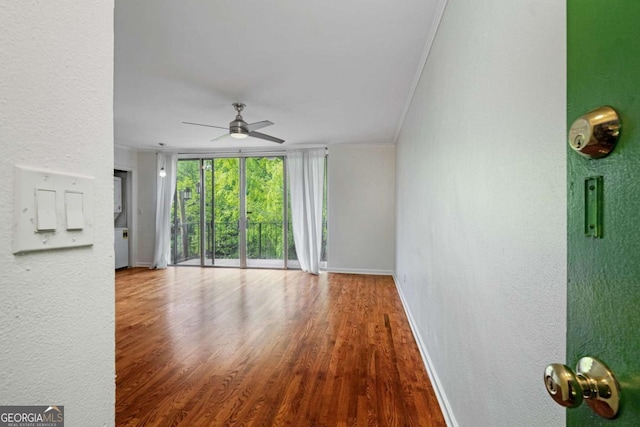 120 Alden Ave NW Unit C3, Atlanta, GA 30309 - unfurnished living room with a textured wall, ceiling fan, baseboards, wood finished floors, and ornamental molding