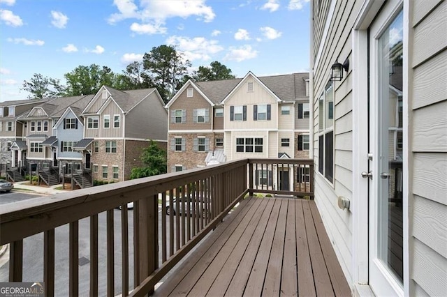 wooden terrace featuring a residential view