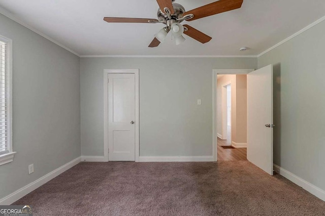 2465 Hogan Rd, Atlanta, GA 30344 - carpeted spare room featuring ceiling fan, crown molding, and a smoke detector