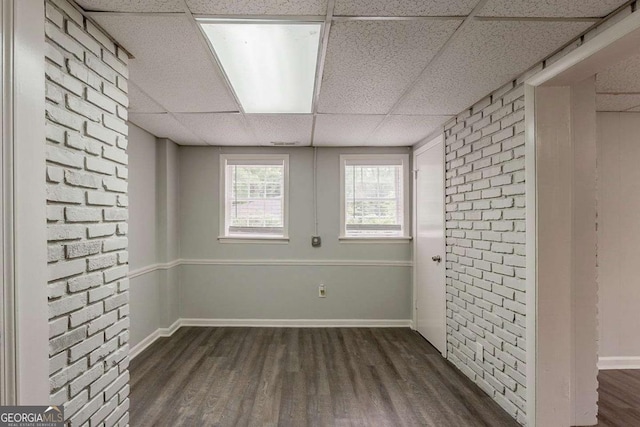 2465 Hogan Rd, Atlanta, GA 30344 - spare room featuring a paneled ceiling and dark wood-style floors