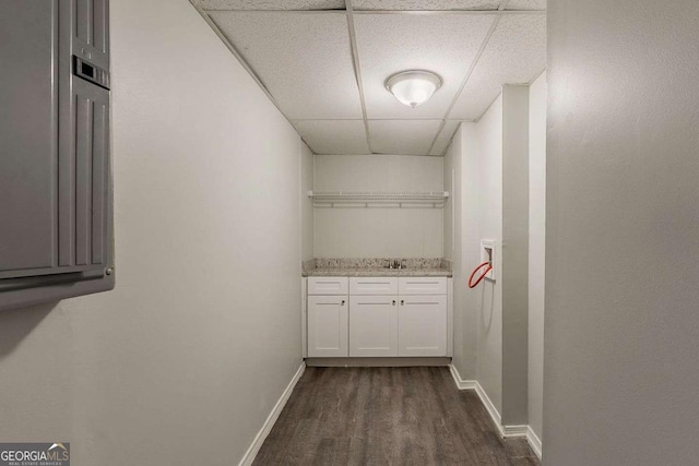 2465 Hogan Rd, Atlanta, GA 30344 - laundry area with dark wood finished floors and baseboards