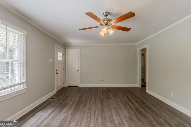 2465 Hogan Rd, Atlanta, GA 30344 - unfurnished room featuring dark wood-type flooring, plenty of natural light, a ceiling fan, and crown molding