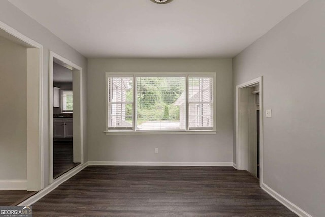 2465 Hogan Rd, Atlanta, GA 30344 - spare room featuring dark wood-style flooring and baseboards