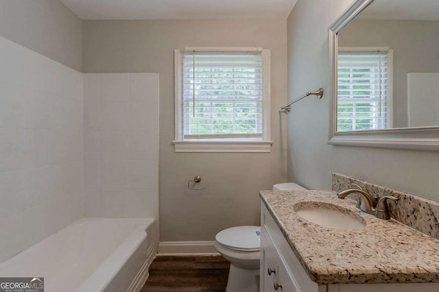 2465 Hogan Rd, Atlanta, GA 30344 - bathroom featuring healthy amount of natural light, vanity, and wood finished floors