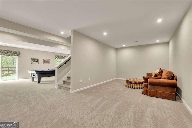 sitting room with carpet floors, recessed lighting, baseboards, and stairs