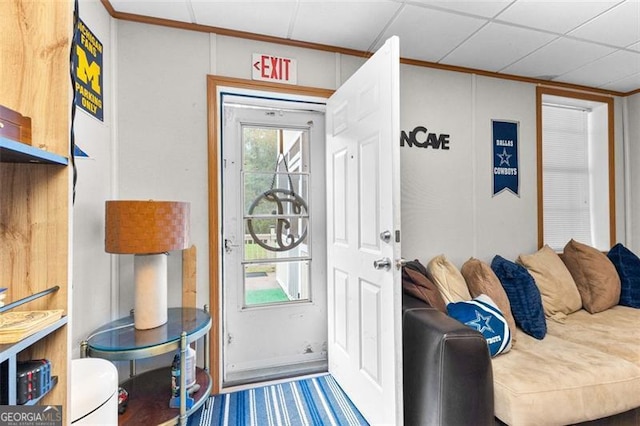 foyer entrance featuring crown molding