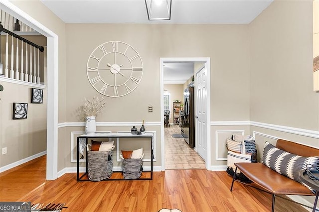 interior space with baseboards and wood finished floors