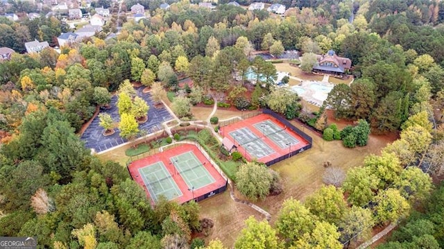drone / aerial view featuring a view of trees