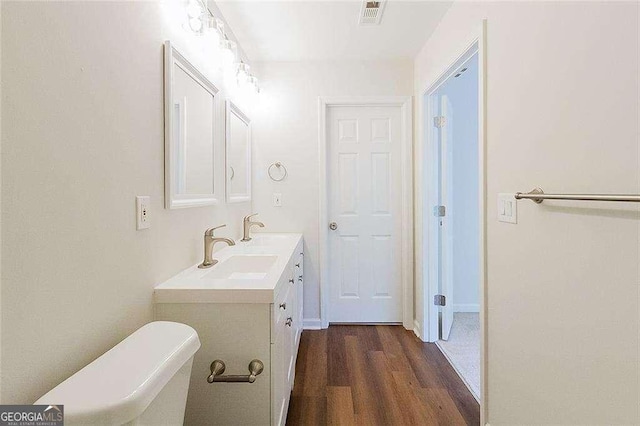 bathroom featuring vanity, wood finished floors, and visible vents