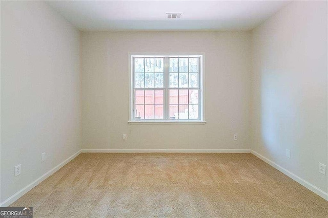 3990 Howell Park Rd, Duluth, GA 30096 - spare room featuring light colored carpet and baseboards