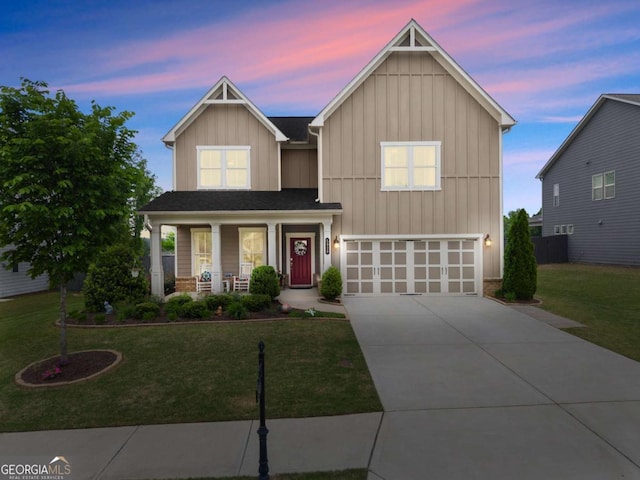 view of front facade with board and batten siding, covered porch, a front yard, concrete driveway, and an attached garage