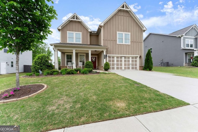 craftsman-style home featuring an attached garage, central AC, board and batten siding, a porch, and concrete driveway