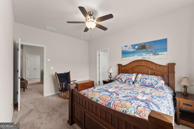 bedroom featuring ceiling fan, light carpet, and baseboards