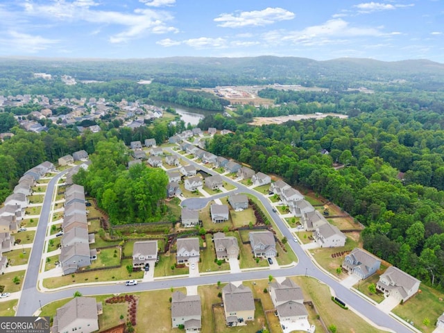 bird's eye view with a residential view and a wooded view