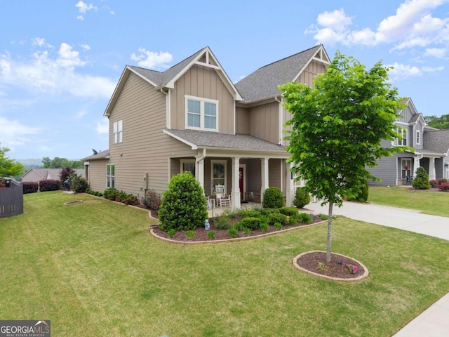 craftsman house with board and batten siding, driveway, a porch, and a front lawn