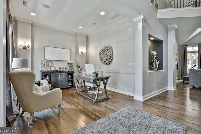home office with visible vents, ornamental molding, baseboards, and wood finished floors