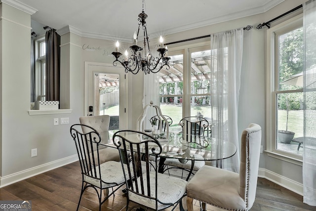 186 Lake Forest Dr, Newnan, GA 30265 - dining space featuring healthy amount of natural light, a chandelier, ornamental molding, and wood finished floors